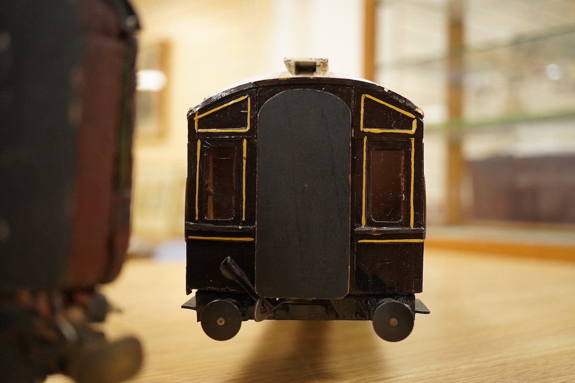 Two Gauge One bogie coaches; a Midland Railway clerestory coach, together with a 12-wheel Pullman car (bogies af), plus an American outline caboose, some scratch building and adaptation from kits, etc.